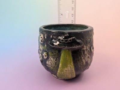 Get In Loser Handle-less Teacup - Cratered Black and Green with Floating Teal Inside